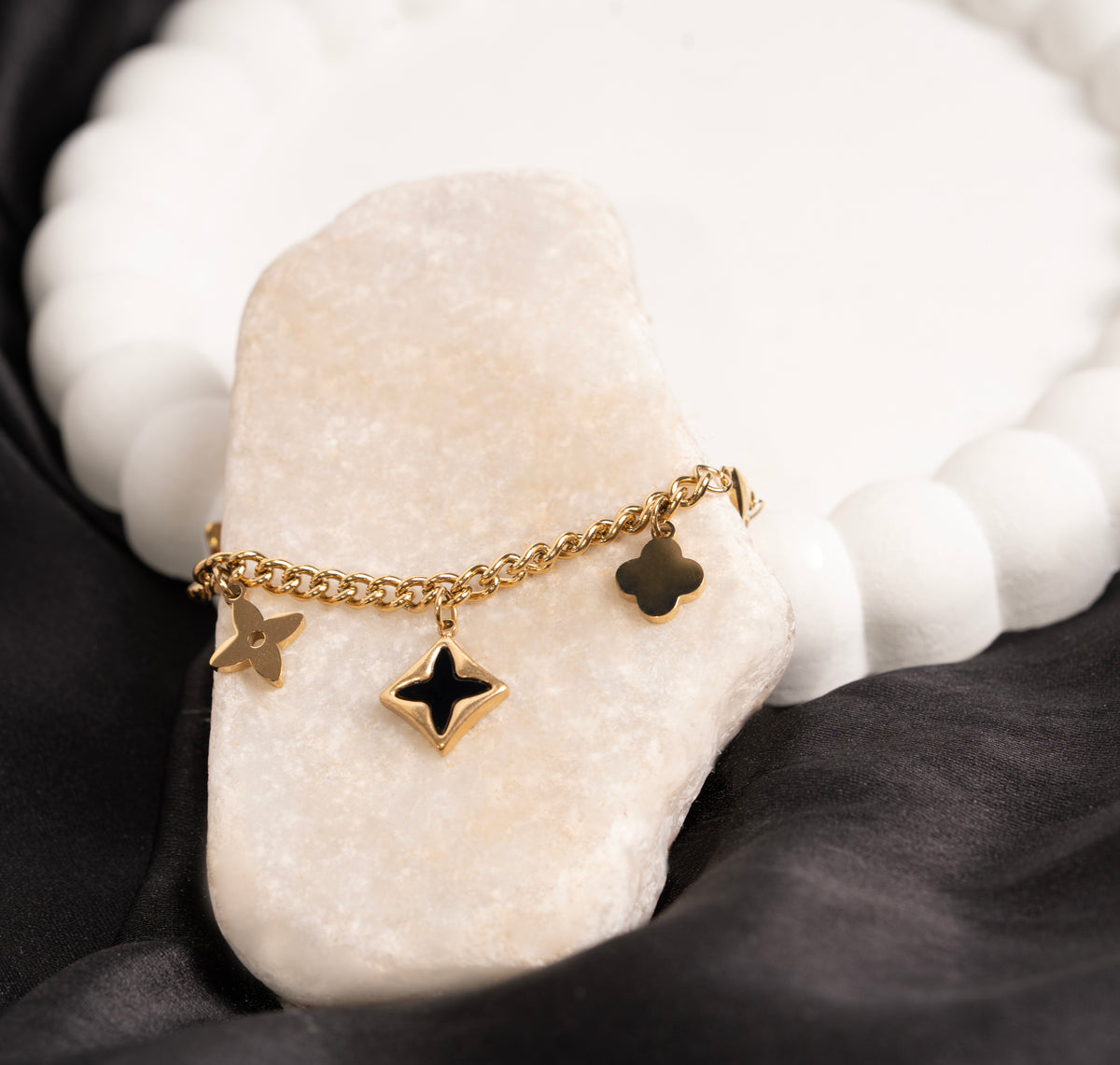 Layered charm bracelet